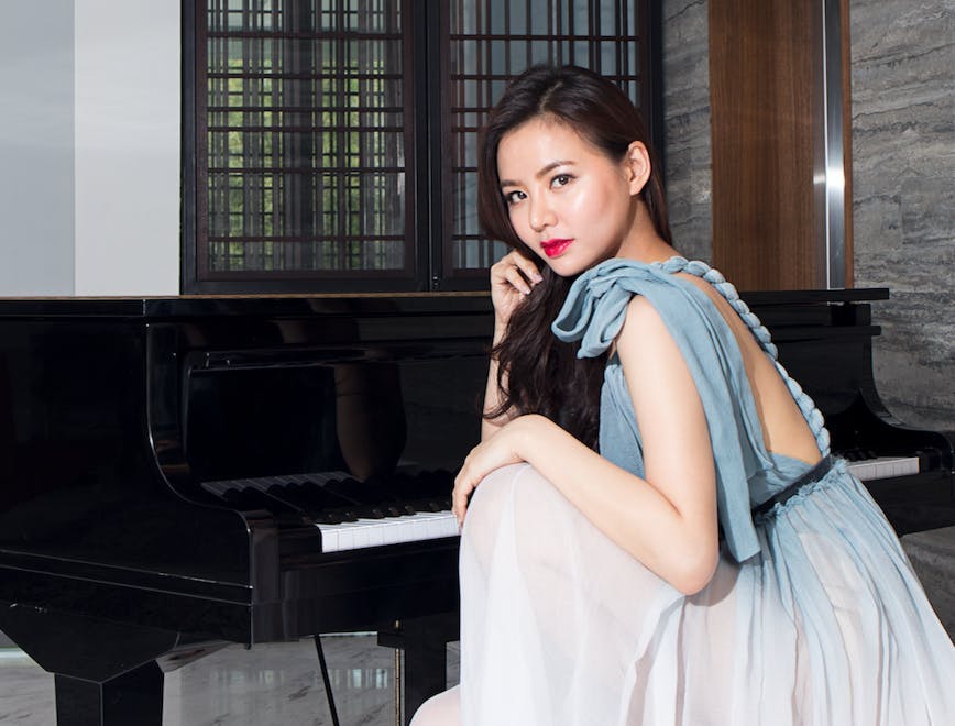 piano musical instrument leisure activities person grand piano evening dress fashion gown clothing performer
