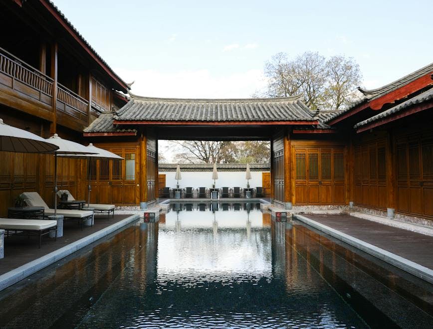 lijiang yunnan resort hotel building pool water