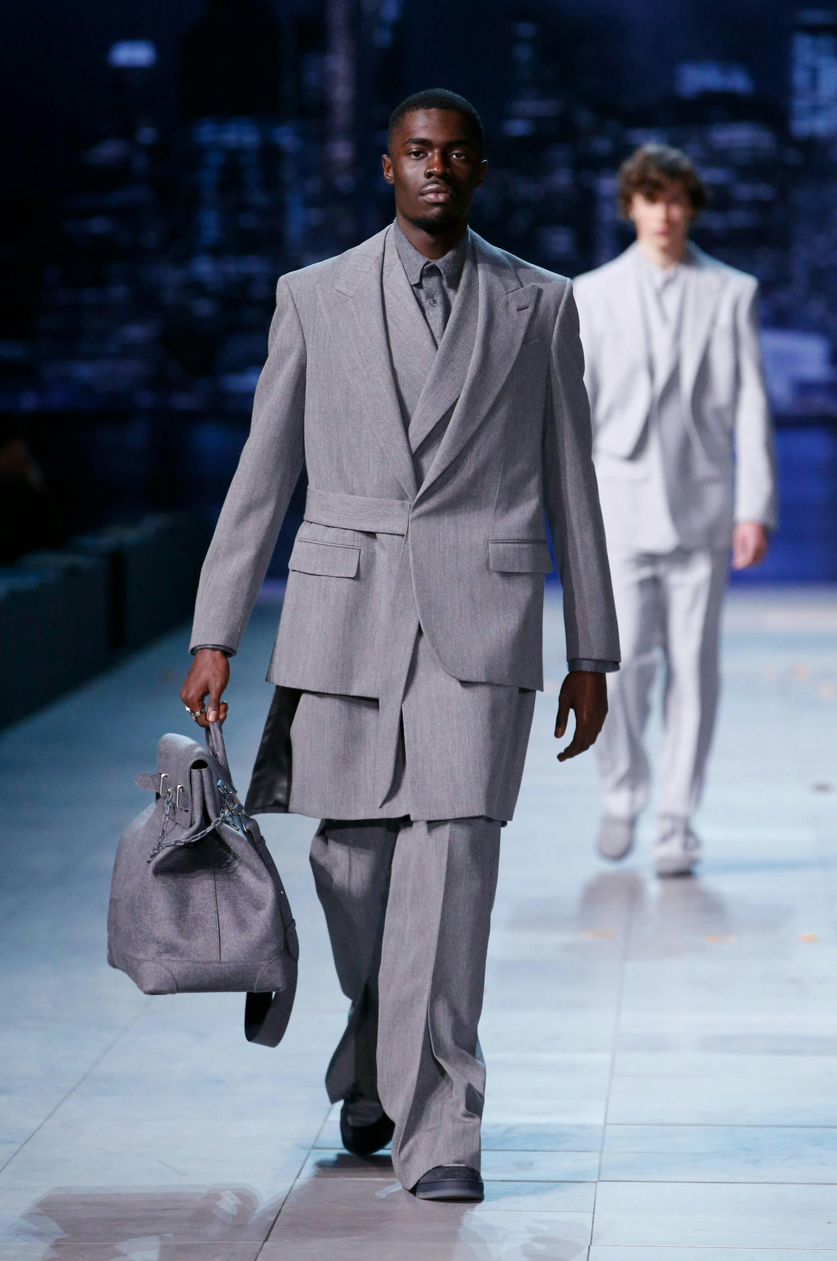 clothing suit overcoat coat person handbag accessories bag man tie