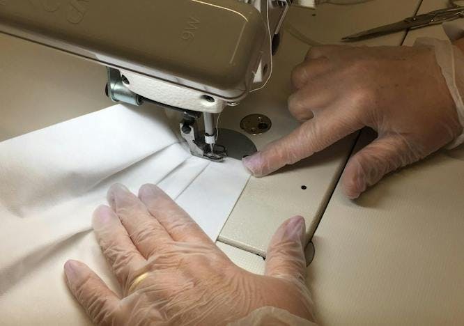 person human sewing finger