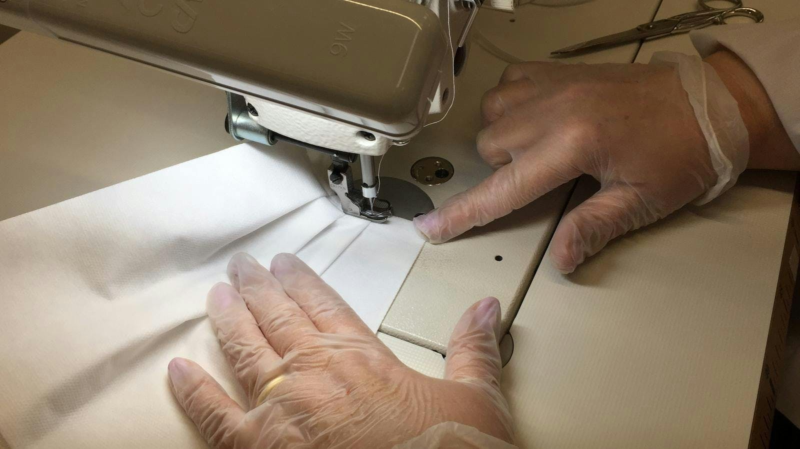 person human sewing finger