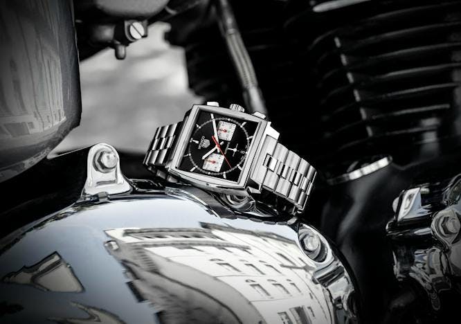 motorcycle transportation vehicle logo symbol trademark wristwatch machine