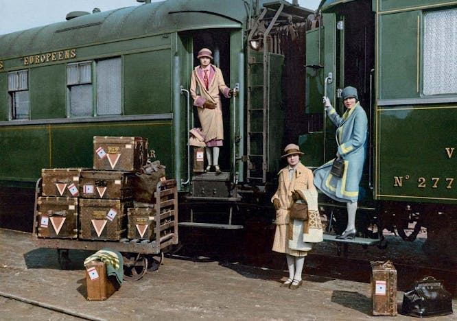 coat clothing apparel person human train transportation vehicle locomotive
