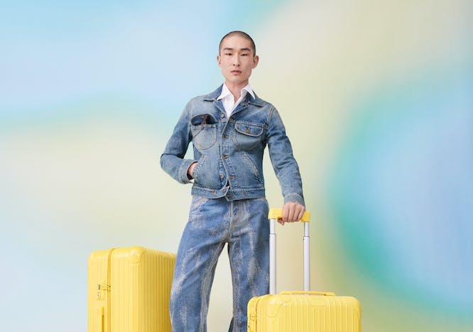 pants clothing apparel luggage person human jeans denim
