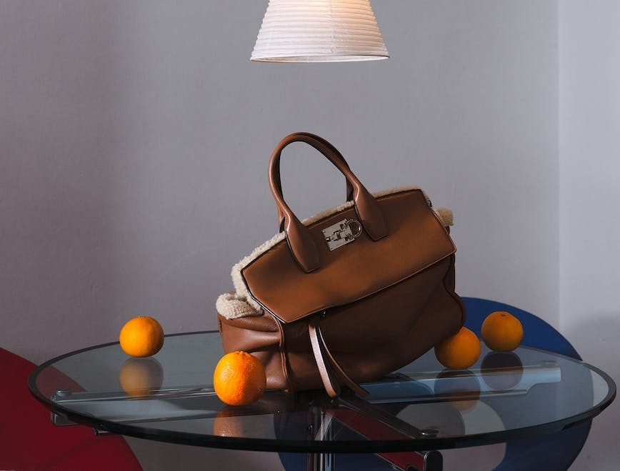 handbag bag accessories purse table furniture chair tabletop citrus fruit produce
