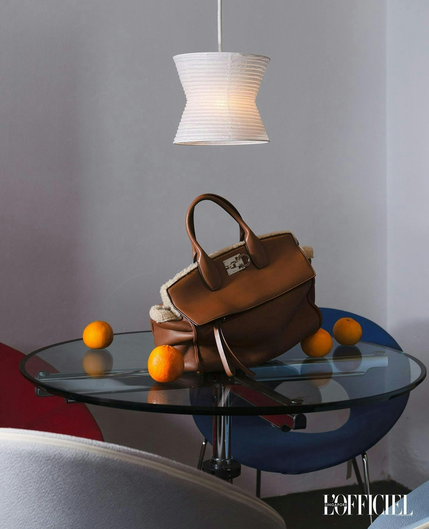 handbag bag accessories purse table furniture chair tabletop citrus fruit produce