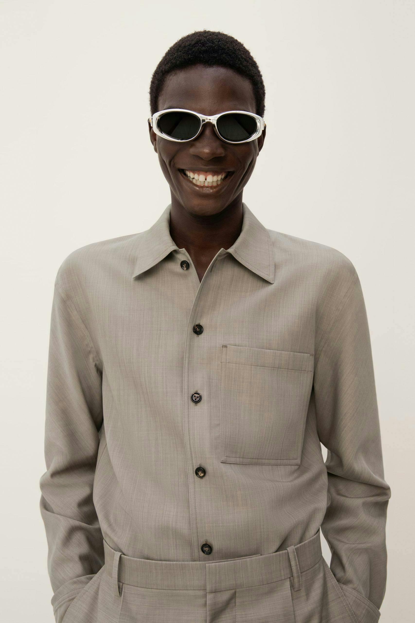 shirt smile head face person sunglasses coat suit man adult