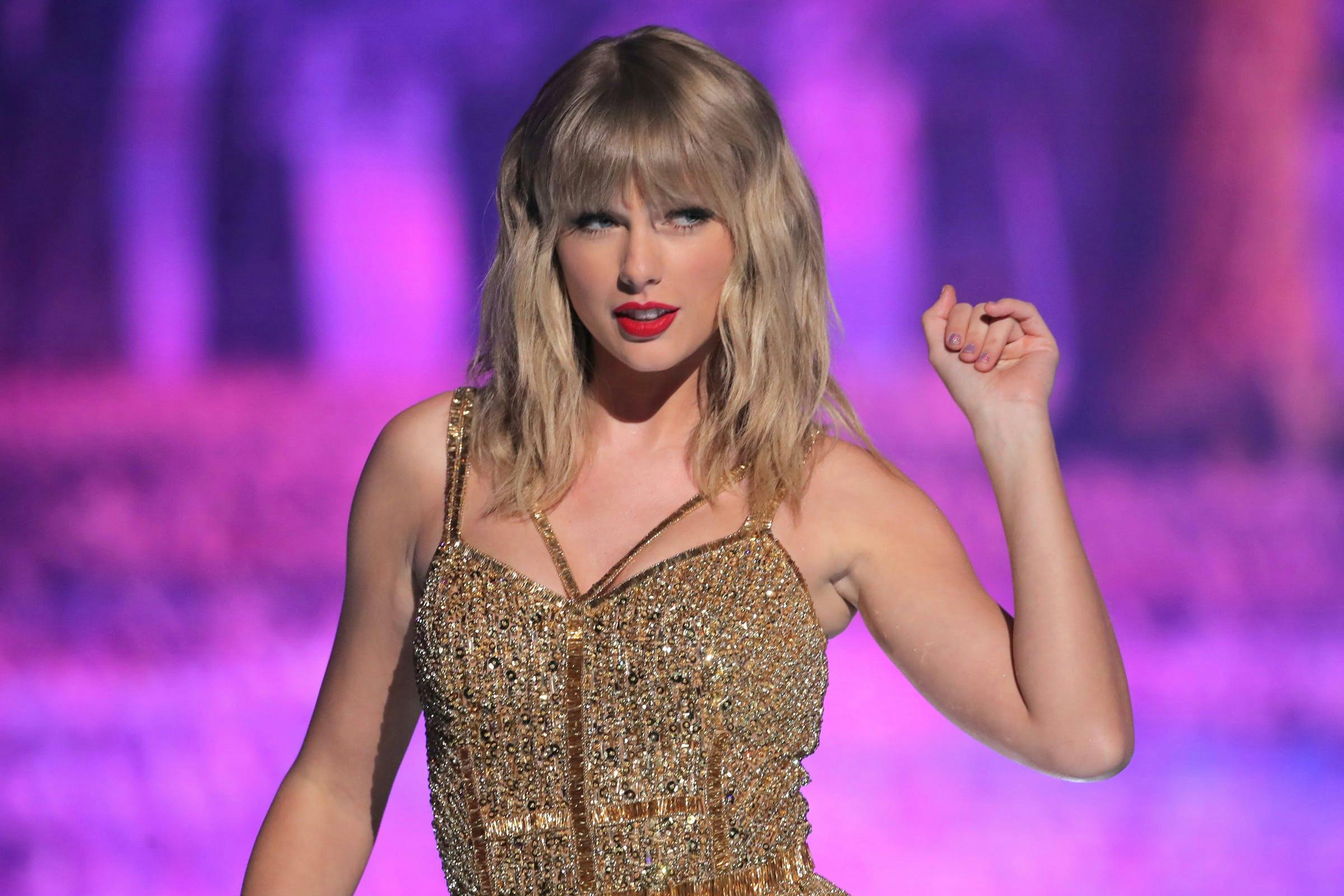 47th annual american music awards show microsoft theater los angeles usa 24 nov 2019 taylor swift amas alone female performing personality 85575667 dress finger person evening dress formal wear fashion adult woman solo performance