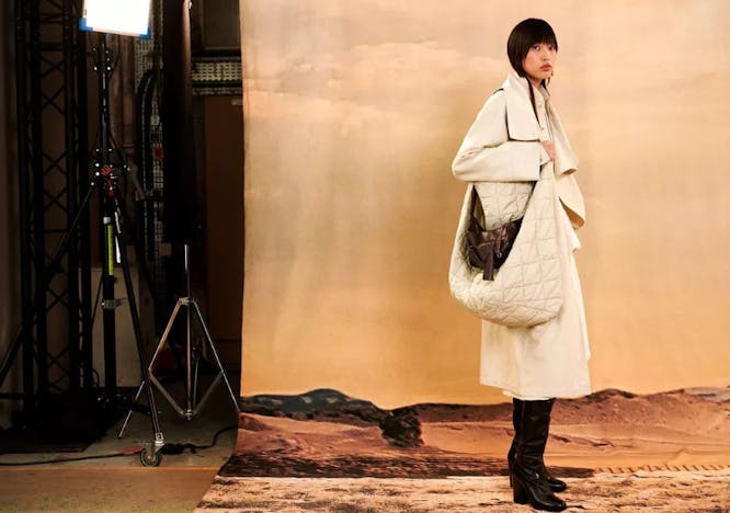 photography clothing coat overcoat person standing accessories bag handbag
